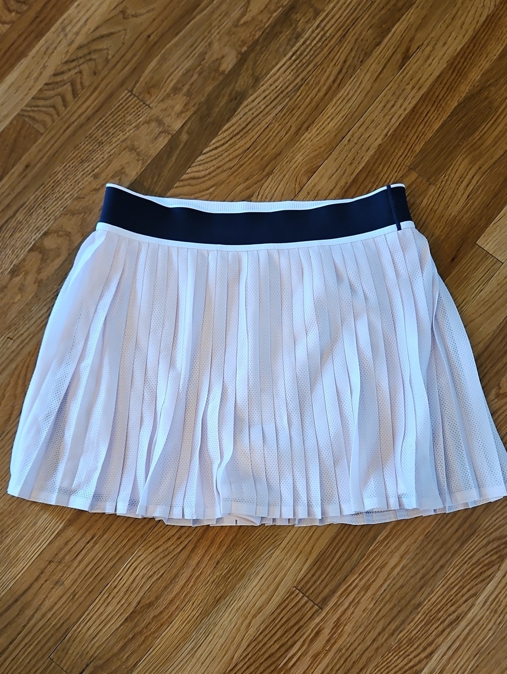 Athleta Women’s Pleated Tennis Skirt with Navy Waistband.